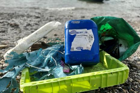 Plastic waste and littler on shoreline - photo credit Preventing Plastic Pollution